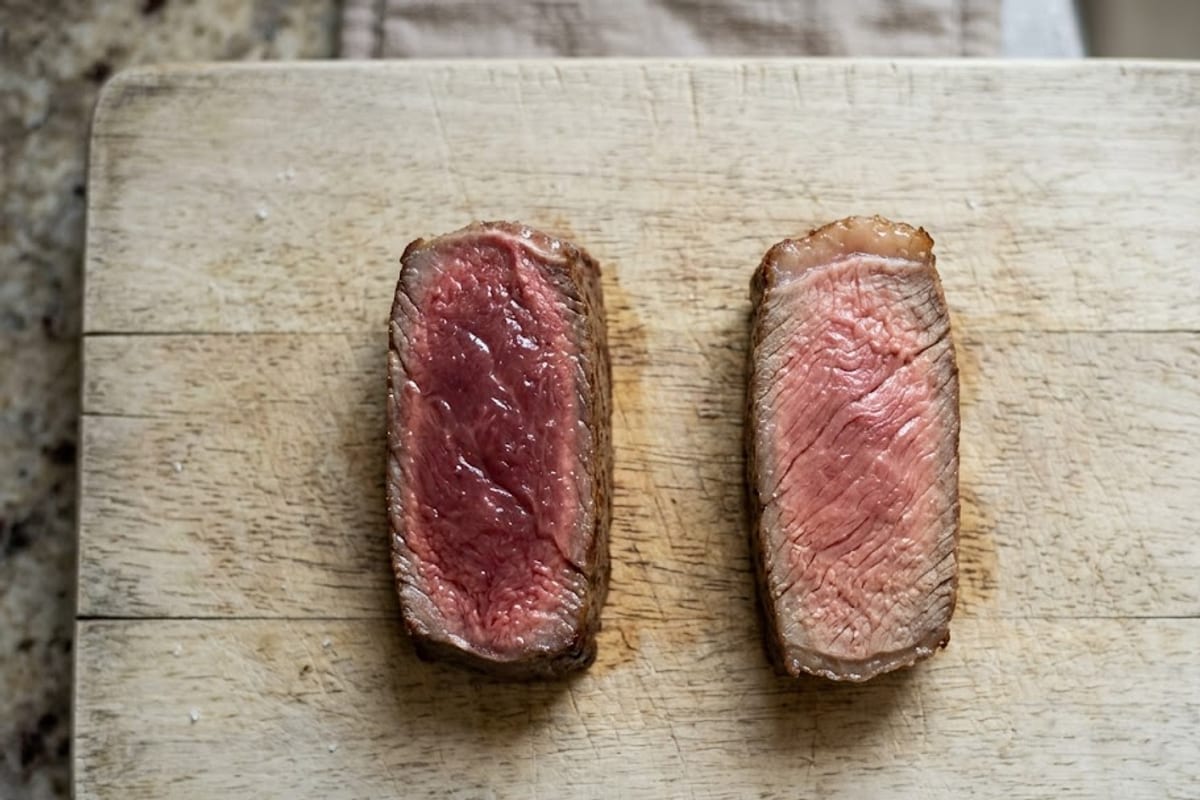 A rare slice beside a medium slice cut from the same steak